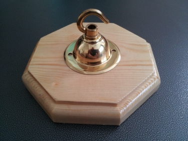 Varnished pine style wooden pattress octagon with brass hook plate